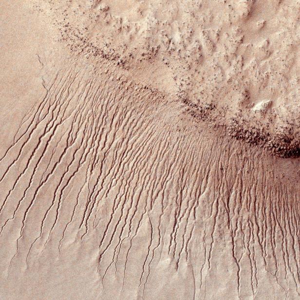 Portions of the Martian surface are pictured from NASA's Mars Reconnaissance Orbiter