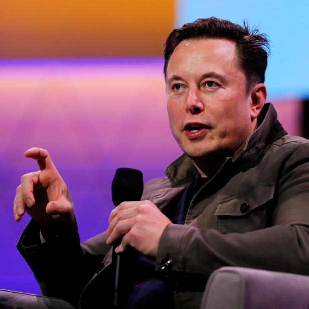 FILE PHOTO: Tesla CEO Elon Musk gestures during a conversation at the E3 gaming convention in Los Angeles