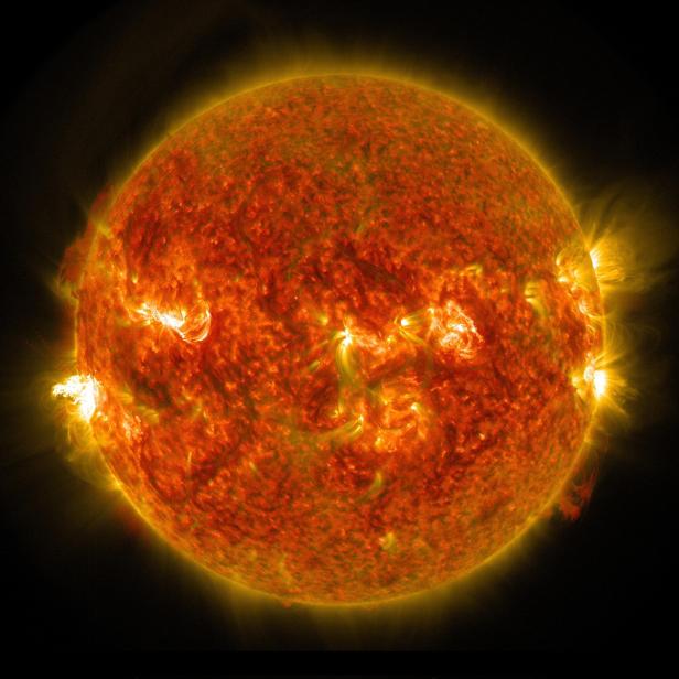 The sun emits a mid-level solar flare which erupted on the left side of the sun
