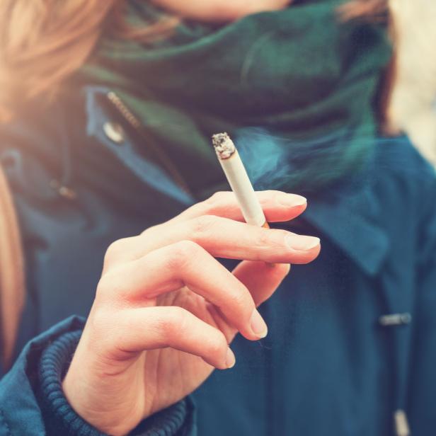 Young woman enjoying a cigarette