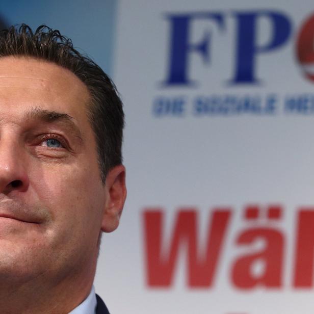 Head of FPOe Strache smiles during an election campaign presentation in Vienna