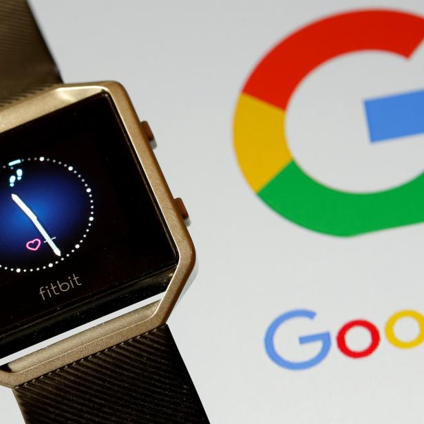 FILE PHOTO: Fitbit Blaze watch is seen in front of a displayed Google logo in this illustration