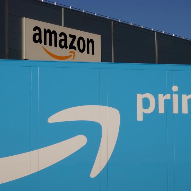 The logo of Amazon Prime Delivery is seen on the trailer of a truck outside the company logistics center in Lauwin-Planque