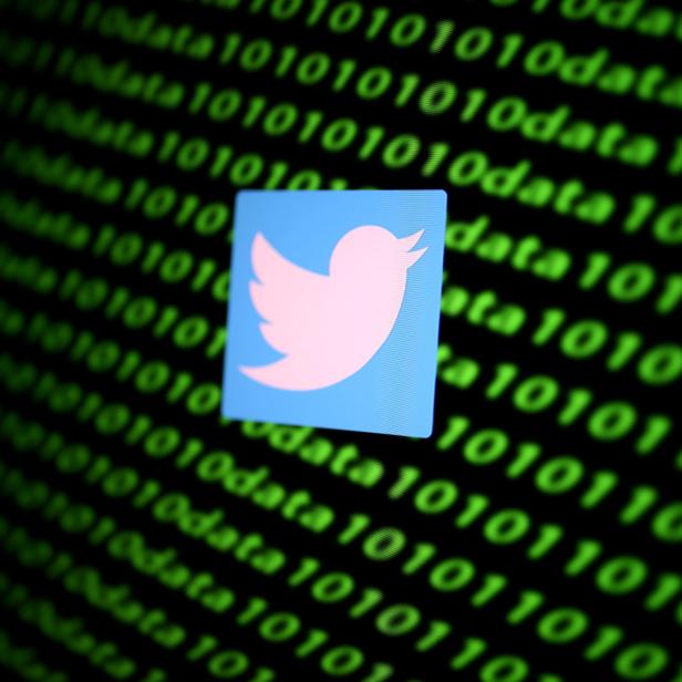 FILE PHOTO: The Twitter logo and binary cyber codes are seen in this illustration