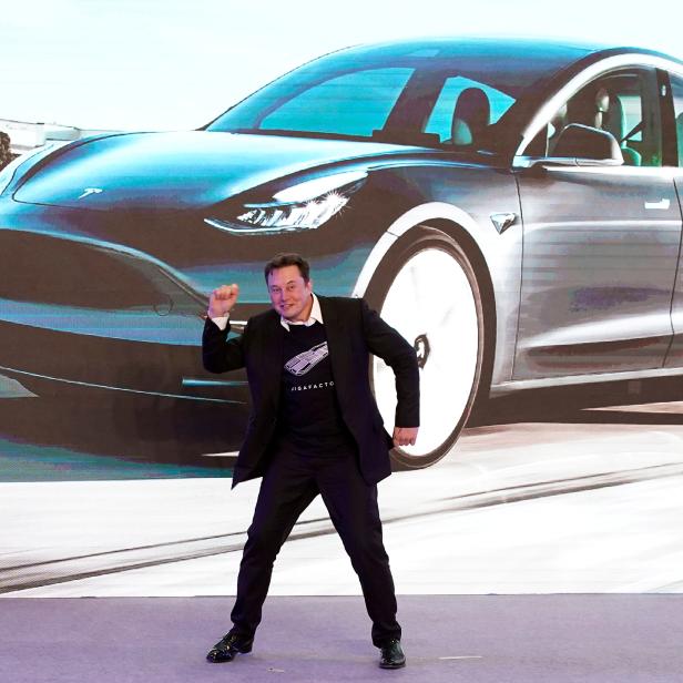 FILE PHOTO: Tesla Inc CEO Elon Musk dances onstage during a delivery event for Tesla China-made Model 3 cars in Shanghai