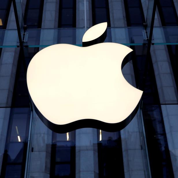 FILE PHOTO: The Apple Inc logo is seen hanging at the entrance to the Apple store on 5th Avenue in New York