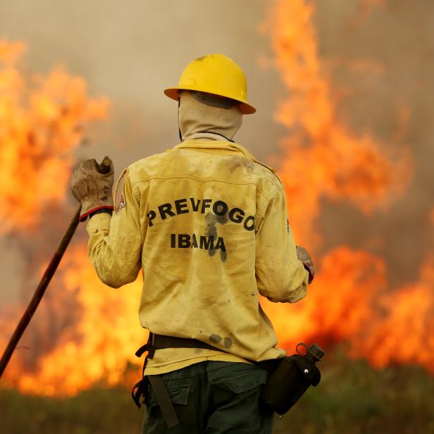 IBAMA fire brigade member is seen as he attempts to control hot points during a fire at Tenharim Marmelos Indigenous Land