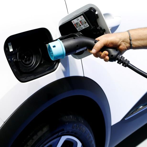 FILE PHOTO: The charging plug of a Renault Captur E-Tech Hybrid car is seen at Brussels Motor Show