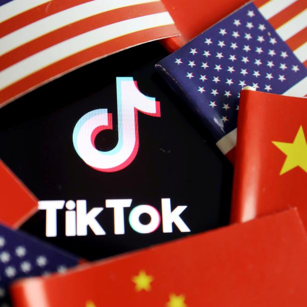 FILE PHOTO: Illustration picture of Tiktok with U.S. and Chinese flags