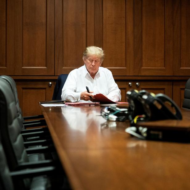 U.S. President Donald Trump works in a conference room while receiving treatment after testing positive for the coronavirus disease (COVID-19) at Walter Reed National Military Medical Center in Bethesda, Maryland