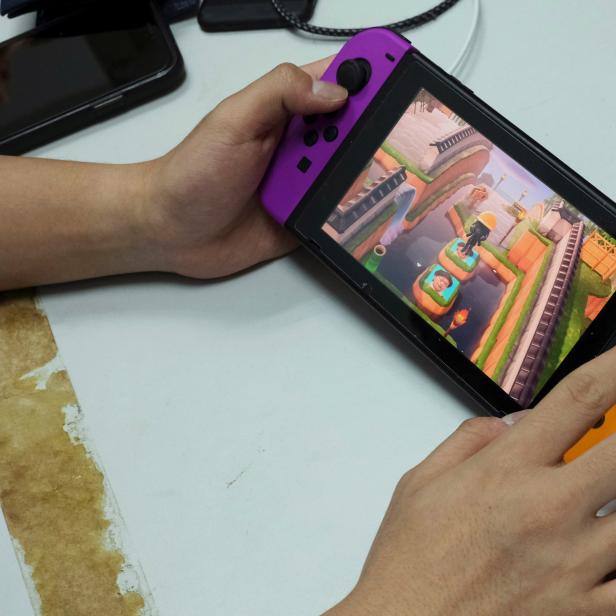 Pro-democracy activists Joshua Wong demonstrates playing the game "Animal Crossing" on Nintendo Switch in Hong Kong