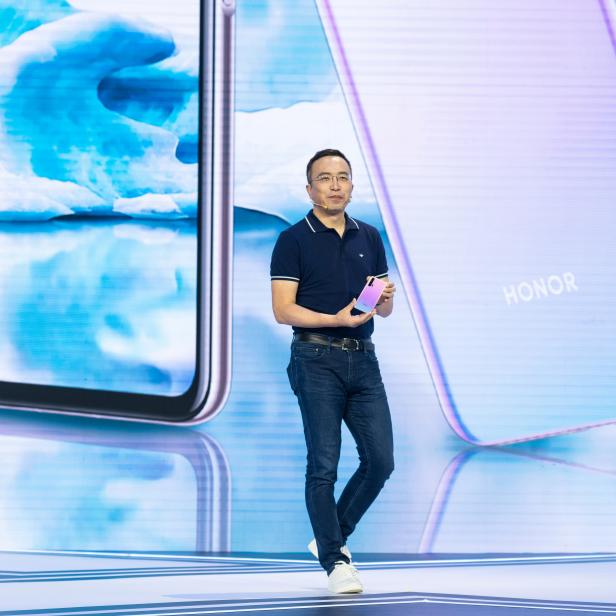 President of Huawei's Honor brand George Zhao displays Honor 20 Pro smartphone with a new colour variant at a launch event in Xian, Shaanxi