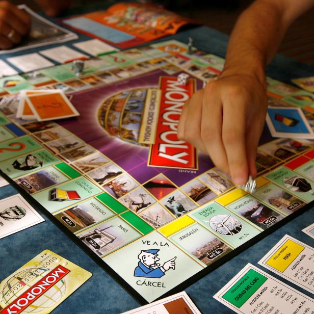 File Photo: A Monopoly player in Madrid participates in an attempt to set a  world record for most people playing the game simultaneously