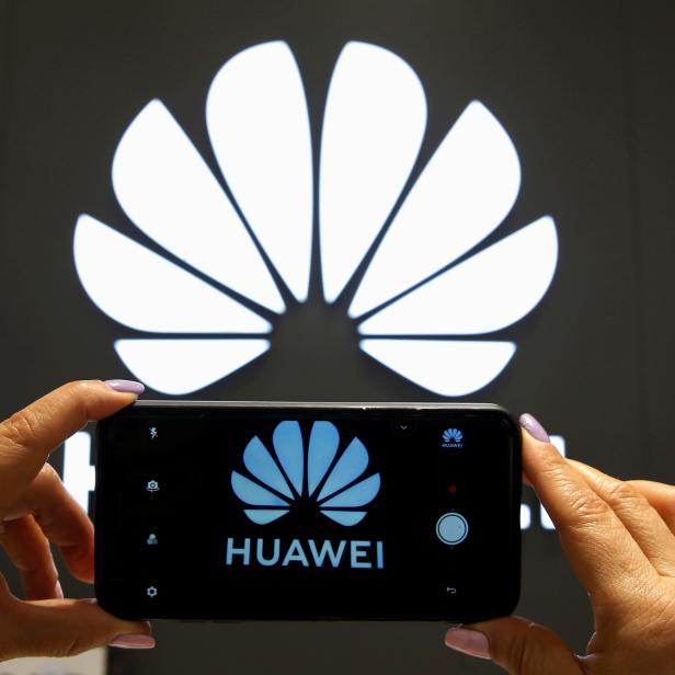 FILE PHOTO: A Huawei logo is seen on a cell phone screen in their store at Vina del Mar