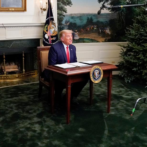 U.S. President Donald Trump  participates in a Thanksgiving video teleconference with members of the military forces at the White House in Washington
