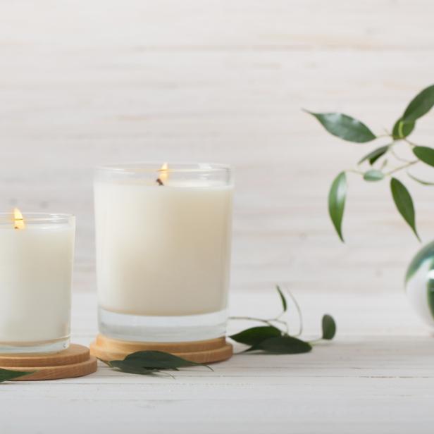 scented candles on white background
