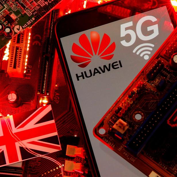 FILE PHOTO: The British flag and a smartphone with a Huawei and 5G network logo are seen on a PC motherboard in this illustration