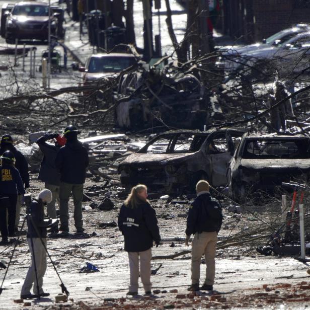 Investigators work near the site of an explosion on 2nd Avenue that occurred the day before in Nashville