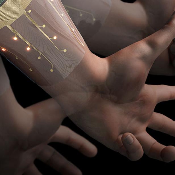 Ein Arm ist mit einer transparenten, elektronischen Schicht mit leuchtenden Punkten überzogen.