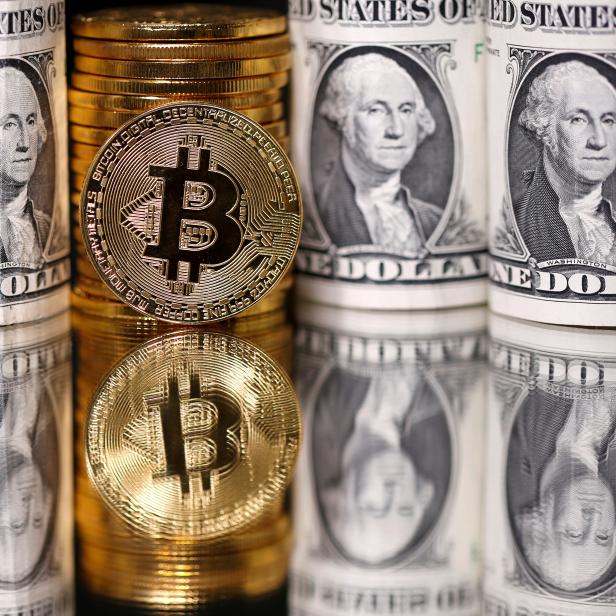 FILE PHOTO: Representations of Bitcoin and U.S. dollar banknotes are seen in this illustration