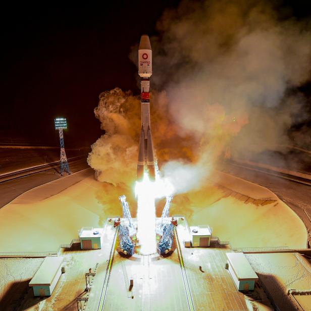 A rocket booster with OneWeb satellites blasts off at the Vostochny Cosmodrome in the Russian Far East