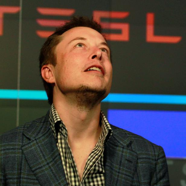 FILE PHOTO: CEO of Tesla Motors Elon Musk reacts following the company's initial public offering at the NASDAQ market in New York