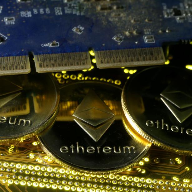 FILE PHOTO: Representations of the Ethereum virtual currency standing on the PC motherboard are seen in this illustration picture