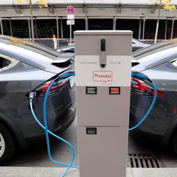 FILE PHOTO: Tesla Model X electric cars recharge their batteries in Berlin