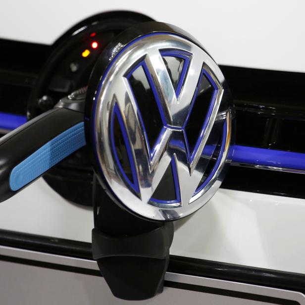 FILE PHOTO: A Volkswagen vehicle is charged during a workshop in Guangzhou