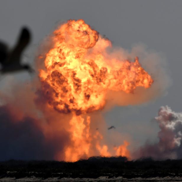 The SpaceX Starship SN9 explodes into a fireball after its high altitude test flight from test facilities in Boca Chica