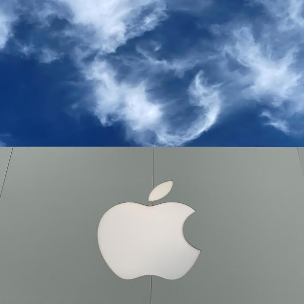 FILE PHOTO: The Apple logo is shown atop an Apple store at a shopping mall in La Jolla, California