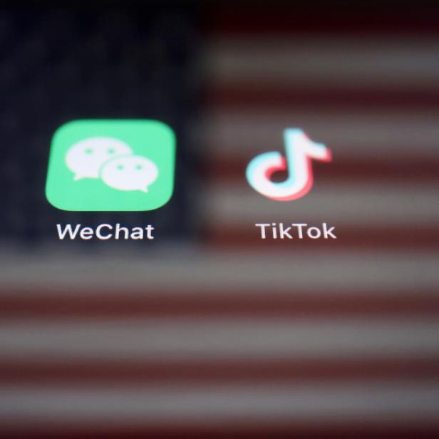 FILE PHOTO: Illustration picture of U.S. flag with WeChat and TikTok