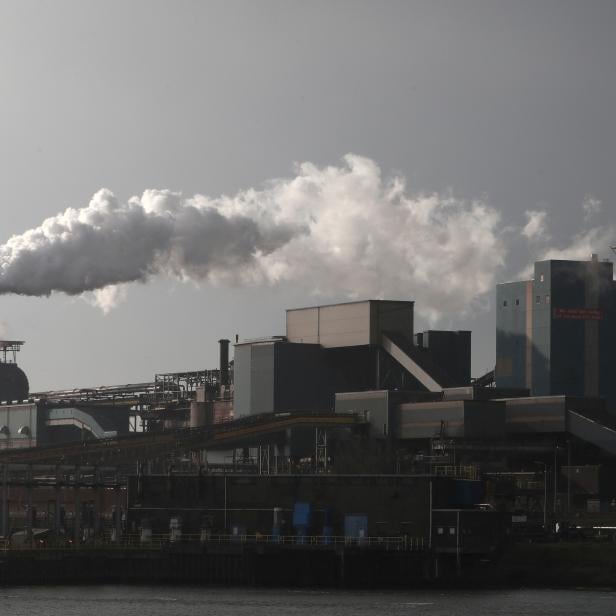 FILE PHOTO: Smoke is seen coming out of a chimney at the Tata steel plant in Ijmuiden