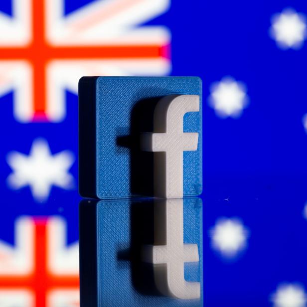 FILE PHOTO: A 3D-printed Facebook logo is seen in front of a displayed Australian flag in this illustration photo