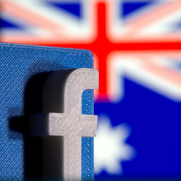 FILE PHOTO: A 3D printed Facebook logo is seen in front of displayed Australia's flag in this illustration photo