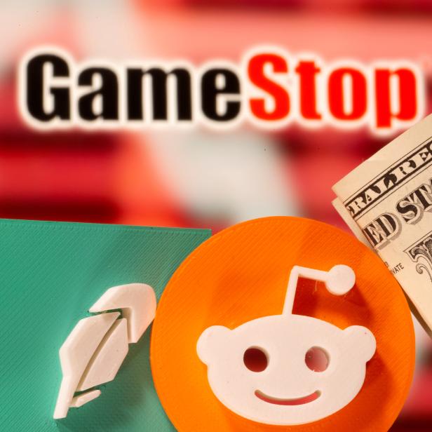 FILE PHOTO: A 3d printed Robinhood and Reddit logos are seen near one dollar banknotes in front of displayed GameStop logo