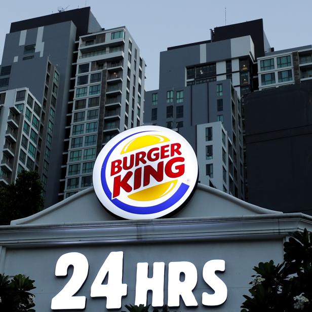 A Burger King logo is seen outside a restaurant in Bangkok