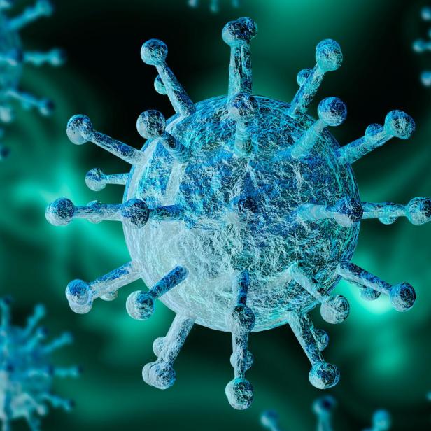Eine Nahaufnahme eines Coronavirus vor einem grünen Hintergrund.