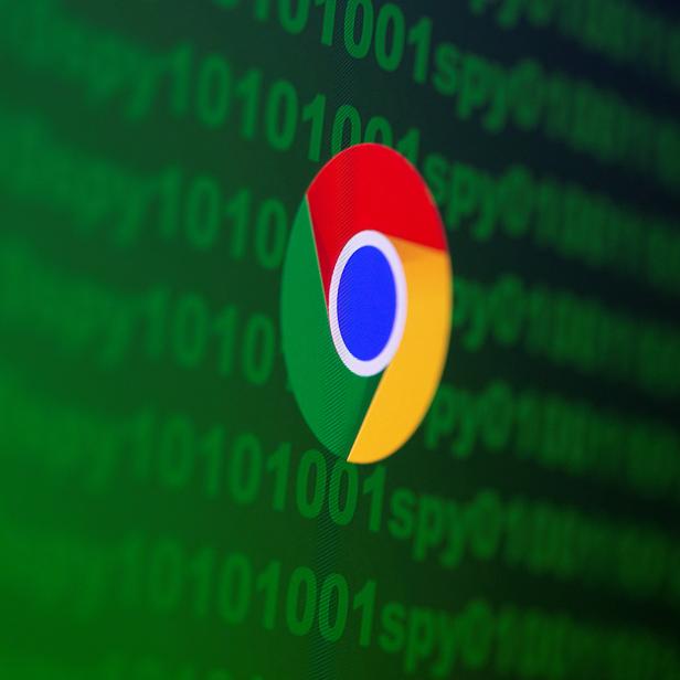 Google Chrome logo is seen near cyber code and words "spy"  in this illustration picture