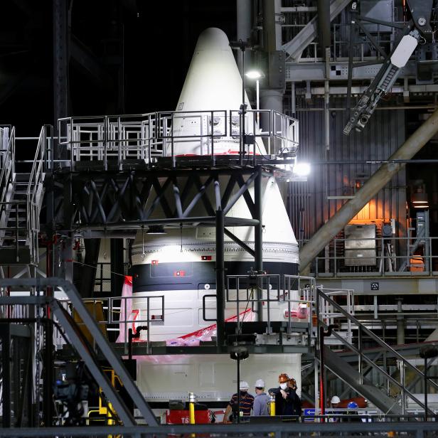 NASA's Artemis solid rocket boosters are shown inside the massive Vehicle Assembly Building at Kennedy Space Center