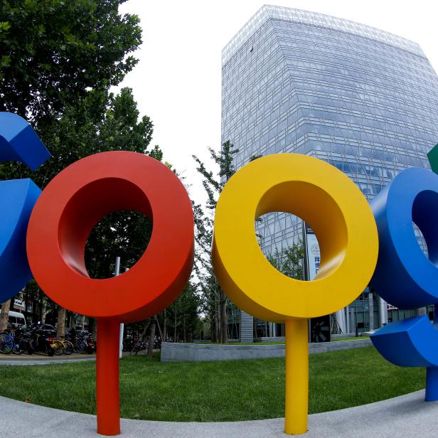 FILE PHOTO: The brand logo of Alphabet Inc's Google is seen outside its office in Beijing