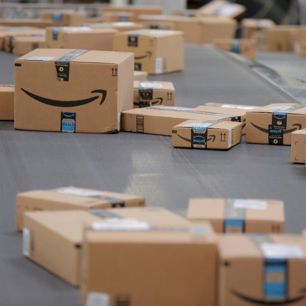 FILE PHOTO: Packages travel along a conveyor belt inside of an Amazon fulfillment center in Robbinsville, New Jersey