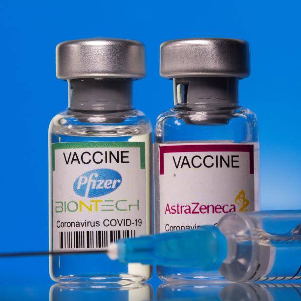 Picture illustration of vials with Pfizer-BioNTech and AstraZeneca coronavirus disease (COVID-19) vaccine labels