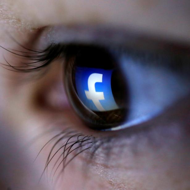 FILE PHOTO: A picture illustration shows a Facebook logo reflected in a person's eye, in Zenica