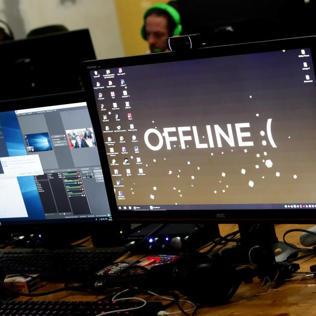 A computer desktop with wallpaper that reads "Offline" is pictured during the Electronic Sports Festival, Austria's largest LAN Party in Vienna
