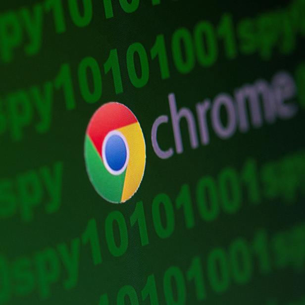 FILE PHOTO: Google Chrome logo is seen near cyber code and words "spy"  in this illustration picture