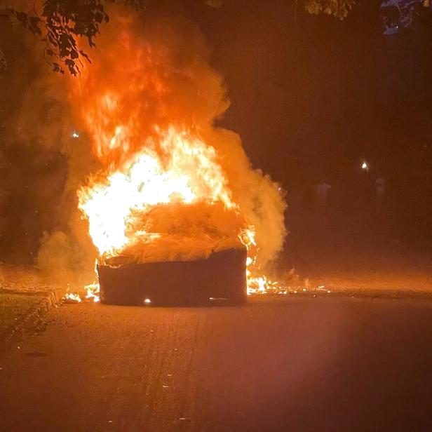 Handout photo of Tesla Inc's new Model S Plaid electric car seen in flames in Pennsylvania