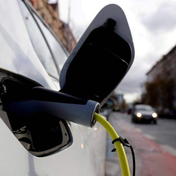 FILE PHOTO: An electric car is charged by a mobile charging station on a street in Prague