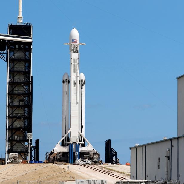 FILE PHOTO: A SpaceX Falcon Heavy rocket with the Arabsat 6A communications satellite aboard is prepared for launch later in the day at the Kennedy Space Center in Cape Canaveral