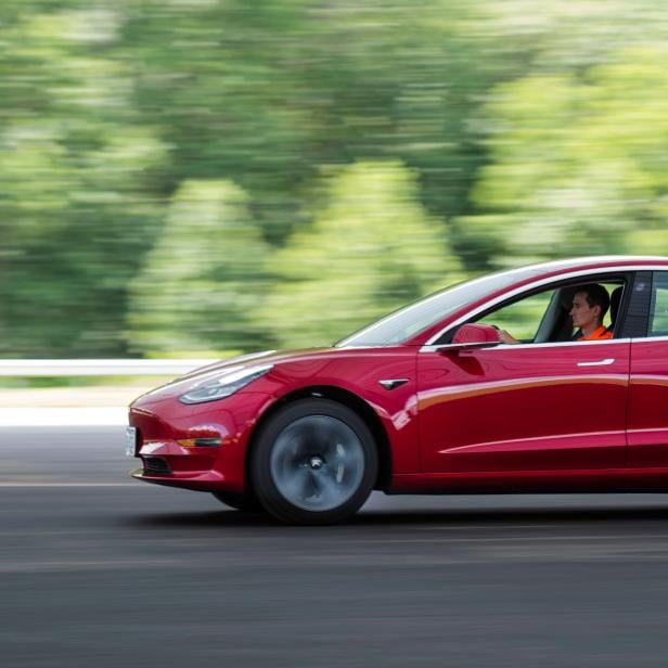 FILE PHOTO: IIHS media relations associate Young drives a Tesla Model 3 at IIHS-HLDI Vehicle Research Center in Ruckersville, Virginia